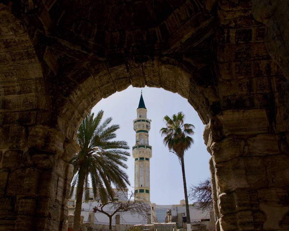 Gurgi Mosque minaret framed by Arch of Marcus Aurelius in the Libyan capital Tripoli's ancient walled city