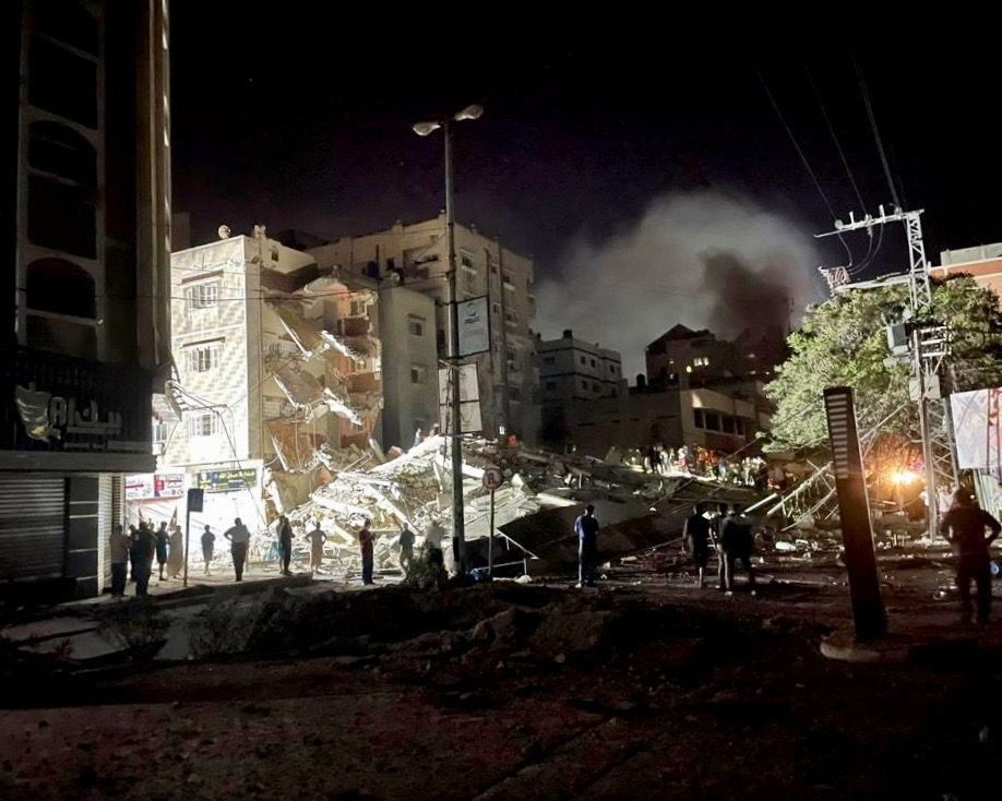 People inspect the rubble from an Israeli airstrike in Gaza City