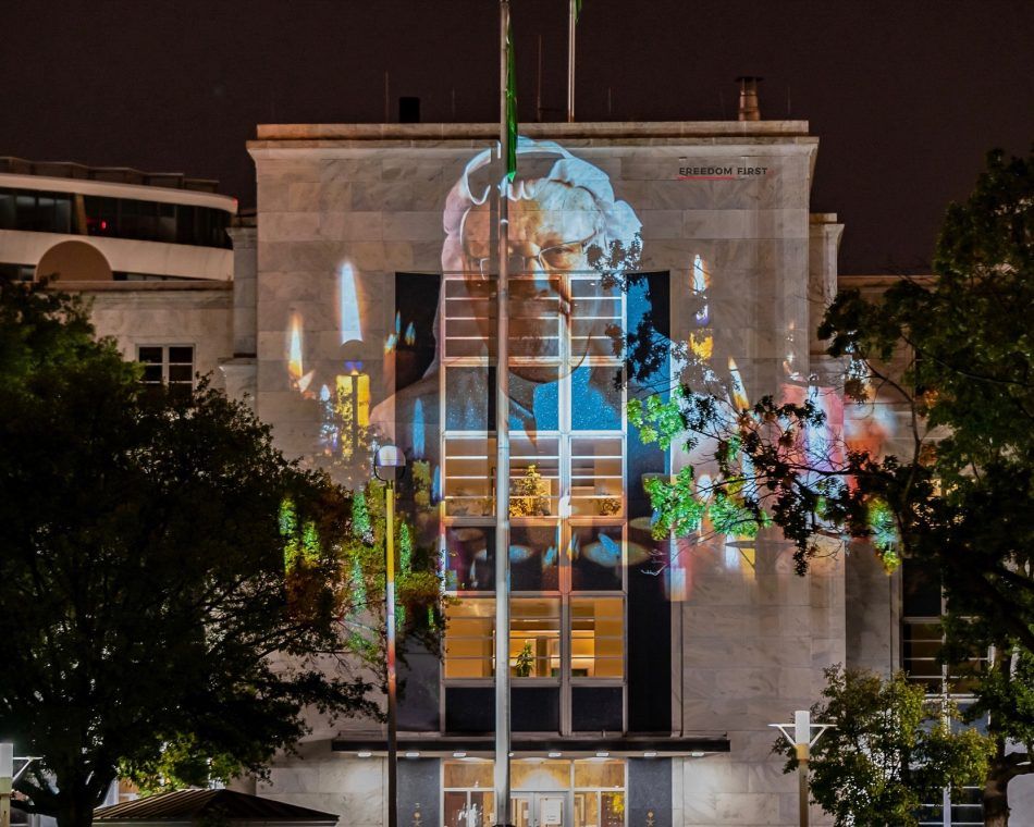 Jamal Khashoggi's likeness is projected onto a Washington building