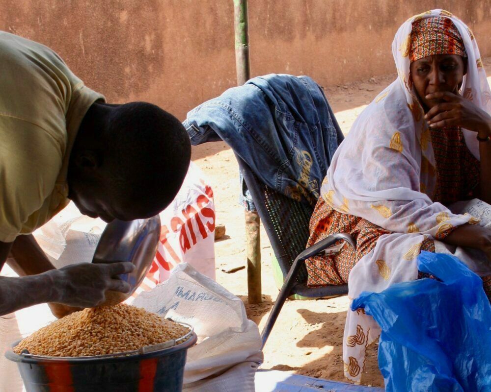 A Malian woman waits at a WFP-organized site in Bamako for food to feed her family of 22