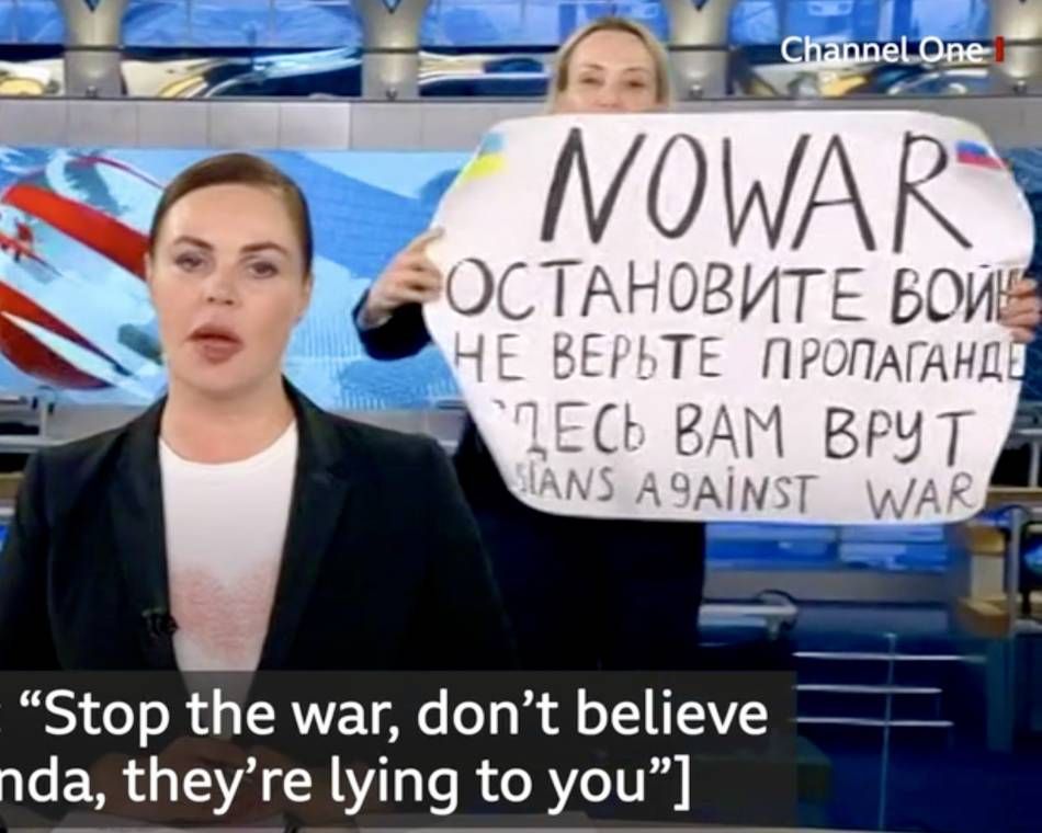 Russian journalist Marina Ovsyannikova interrupts Russian broadcast with a poster demanding an end to war in Ukraine