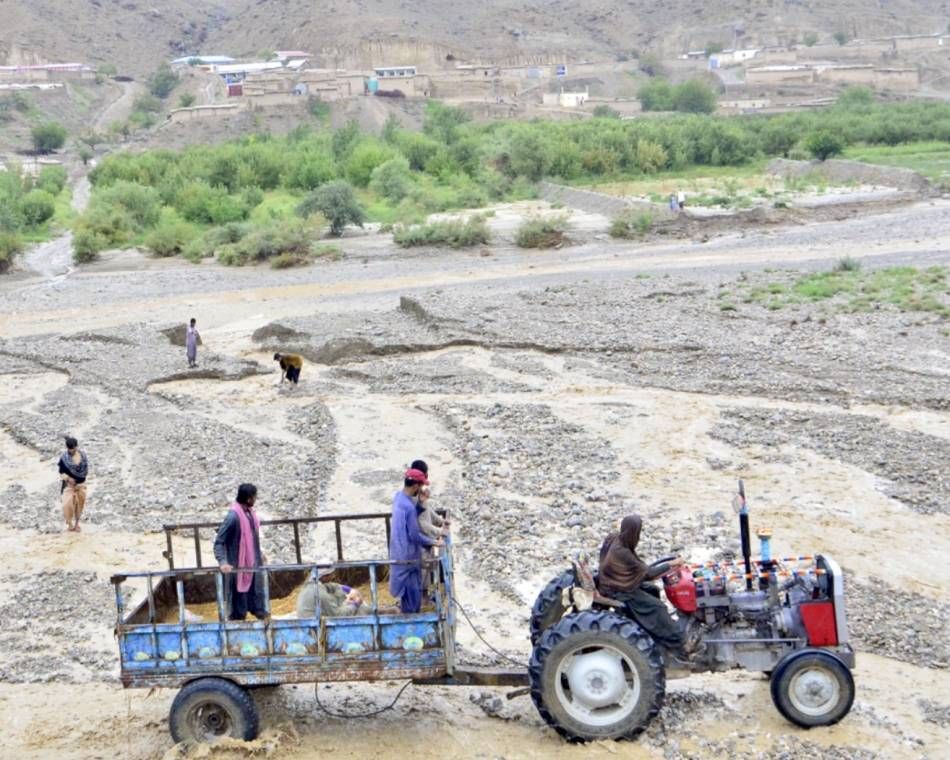 Tractors are the main way of getting around some flooded areas of Pakistan