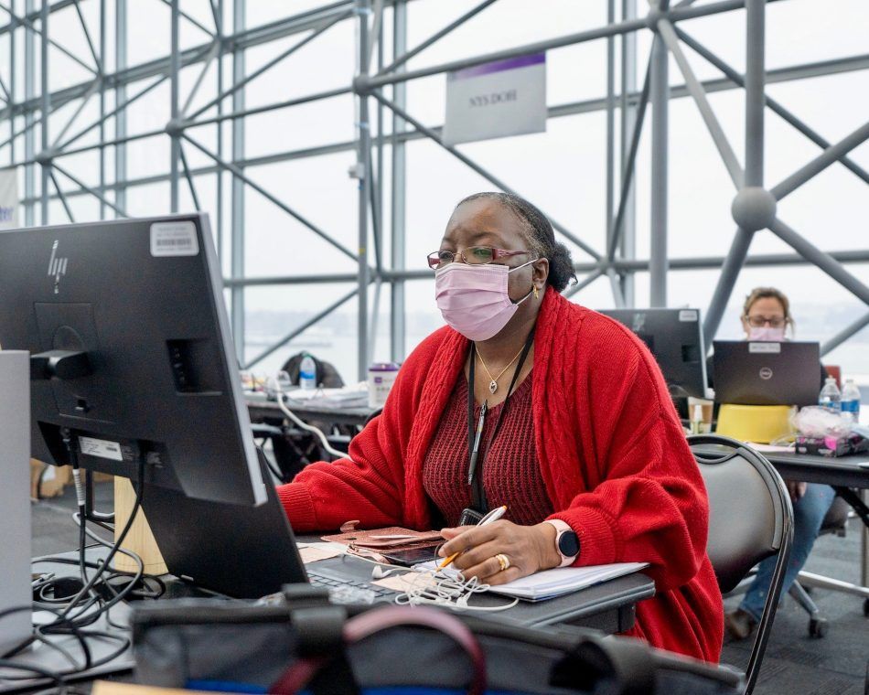 In the U.S., registered nurse Deanna Hill manages New York operations for mass COVID-19 vaccinations