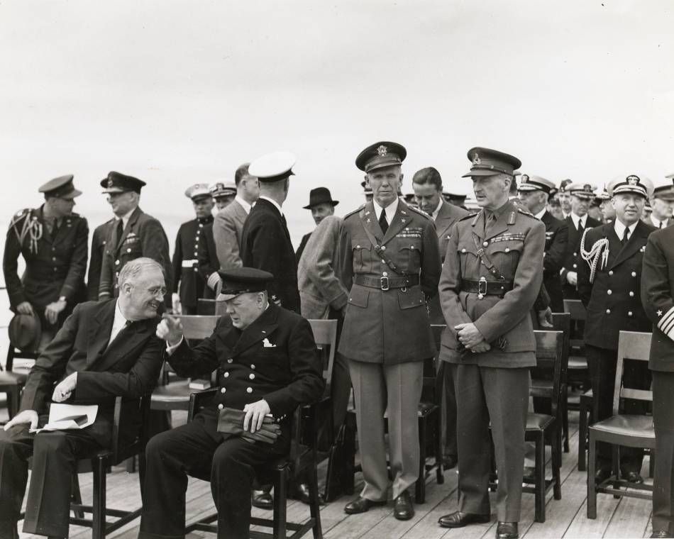President Roosevelt and Prime Minister Churchill, seated, at the Atlantic Conference in Newfoundland