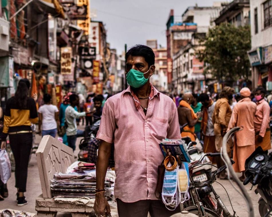 A street vendor sells masks for the pandemic in Varanasi, India, a sacred Hindu city along the Ganges River
