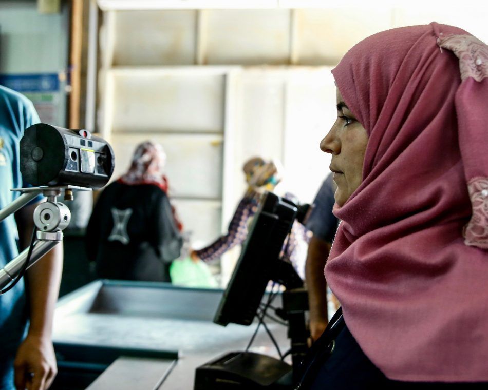 U.N. Women's blockchain cash transfer system in use at a market in Jordan's Azraq camp for Syrian refugees