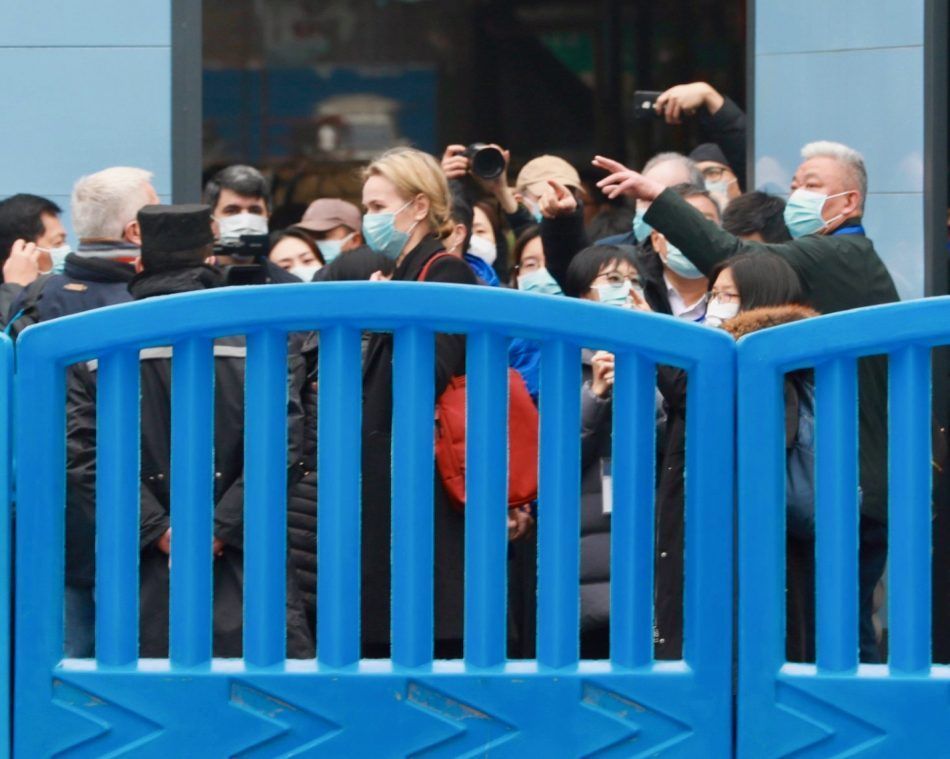 WHO scientists outside the Huanan Seafood Wholesale Market in Wuhan