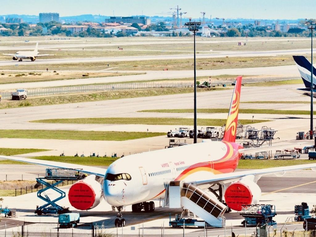 A new Airbus A350-941 at France's Toulouse–Blagnac Airport awaits delivery to China's Hainan Airlines