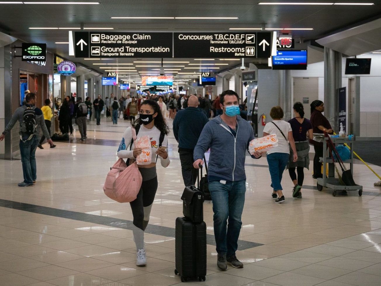 Travelers at Atlanta's international airport wear face masks on March 6th, 2020