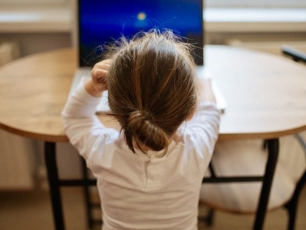 A child at a computer for distance learning during the pandemic