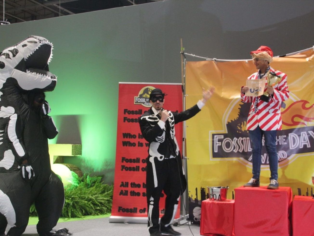 Climate activists in Madrid protest U.S. inaction with a "fossil award"