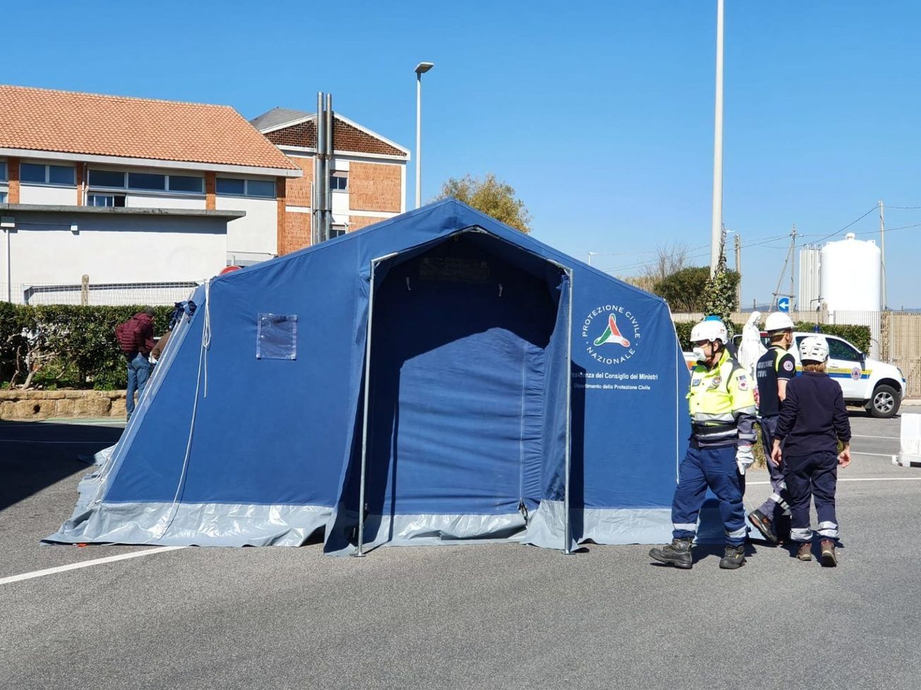 Volunteers set up a COVID-19 pre-triage tent by Italy's Bambino Gesù Children's Hospital