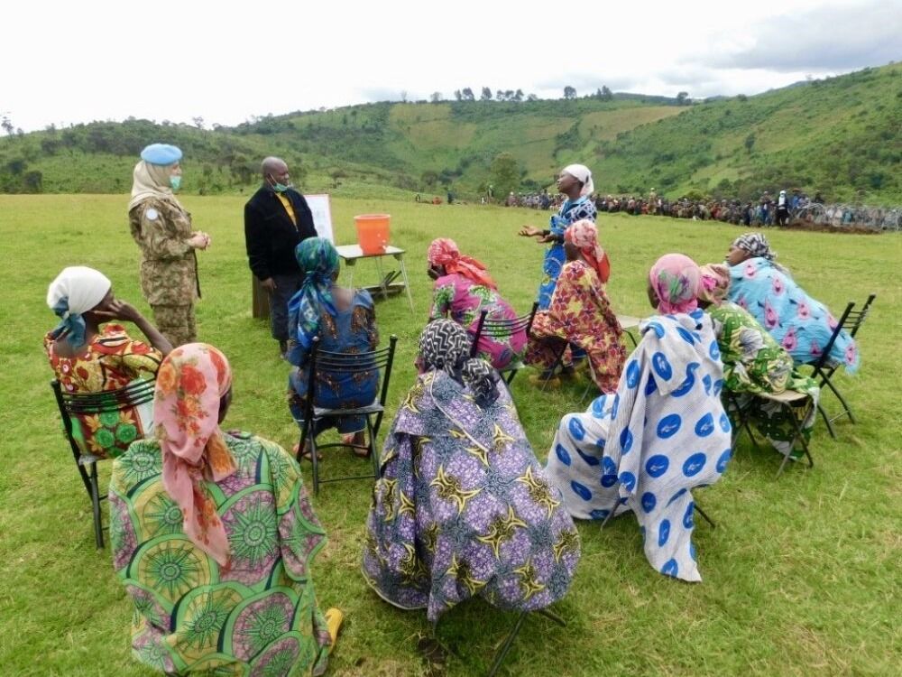 Doctors hold a discussion on COVID-19 in late April with women protected by U.N. peacekeepers in eastern Congo