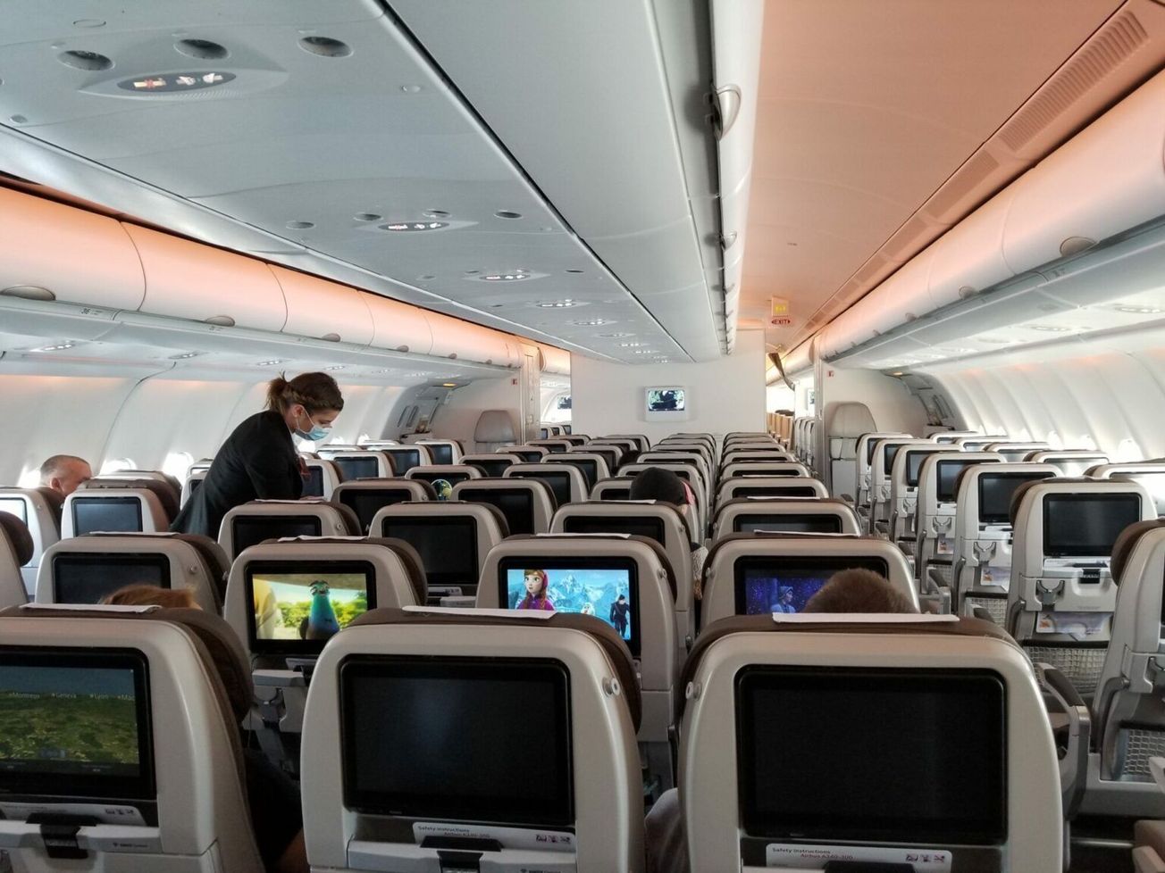 A nearly empty commercial flight from the United States to Europe in April