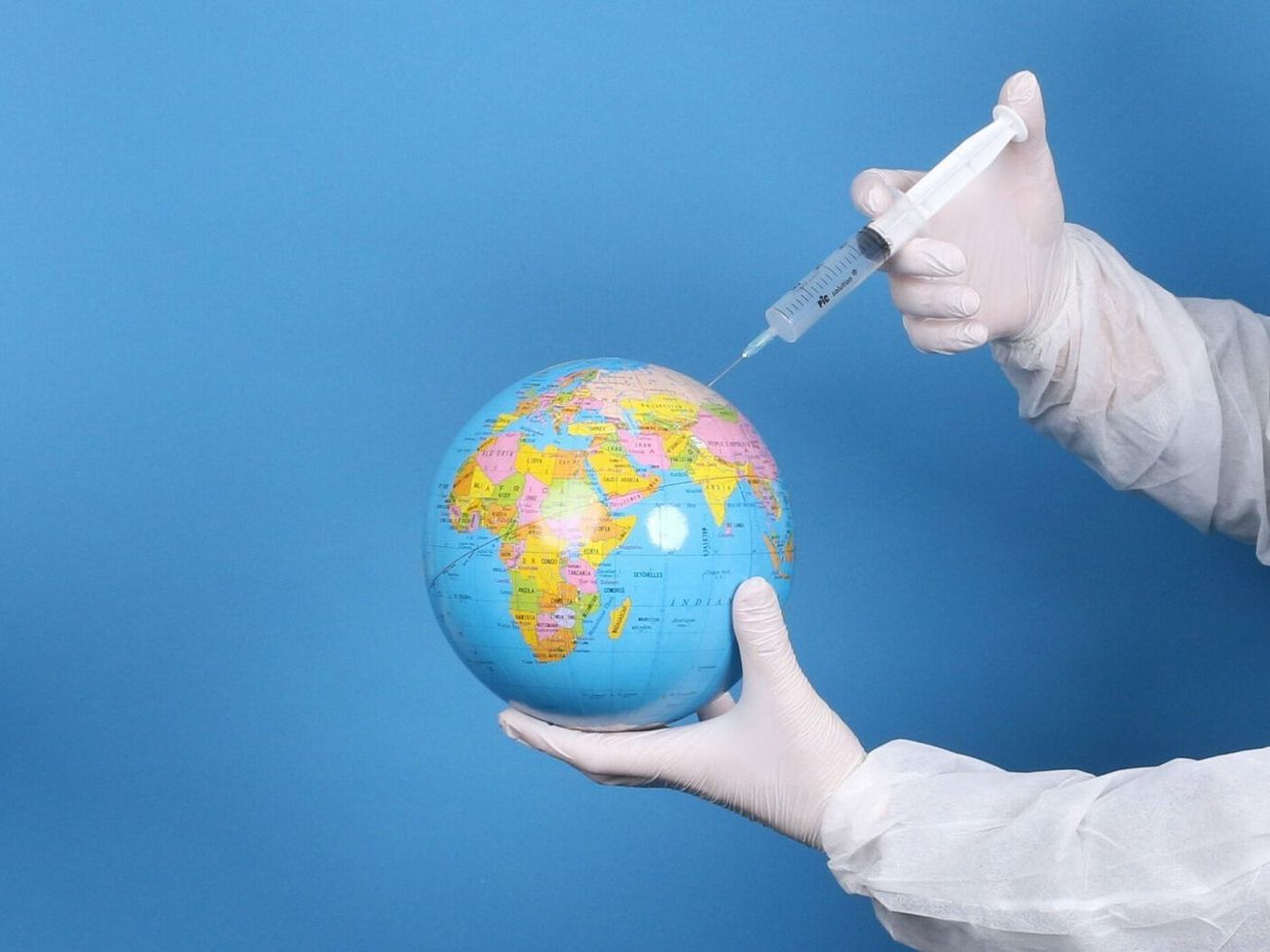 A photo illustration of global vaccine efforts