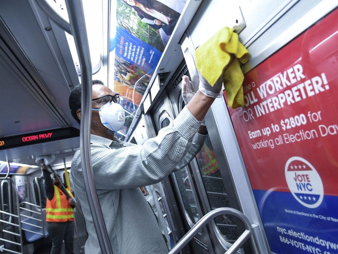 A New York City transit worker disinfects a train on March 3, 2020, as a precaution against coronavirus