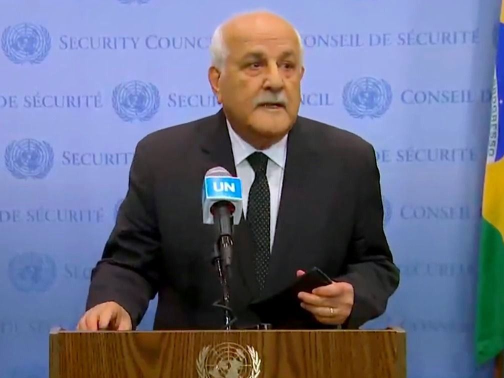 Palestine's U.N. Ambassador Riyad Mansour speaks to reporters outside the Security Council