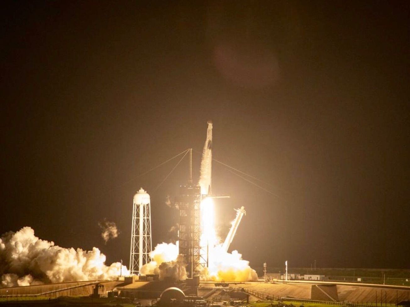 A SpaceX Falcon 9 rocket lifts off with four astronauts headed for the International Space Station