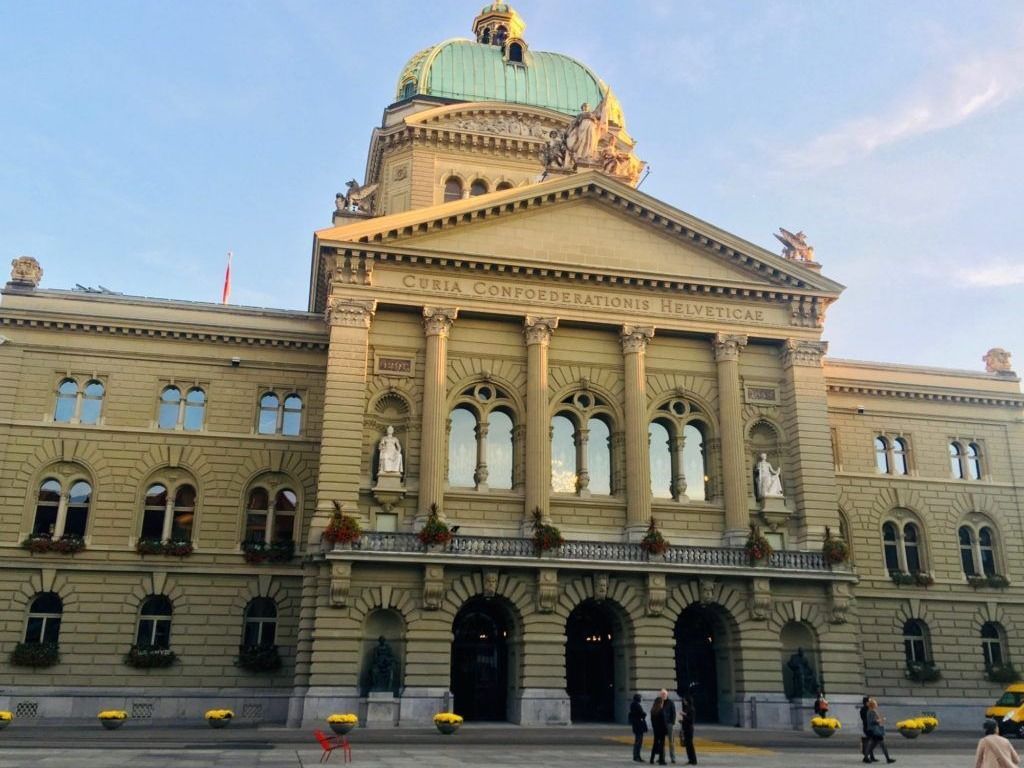 The Bundeshaus, or Swiss Parliament Building, towers over the Bundesplatz, or Federal Square, in Bern