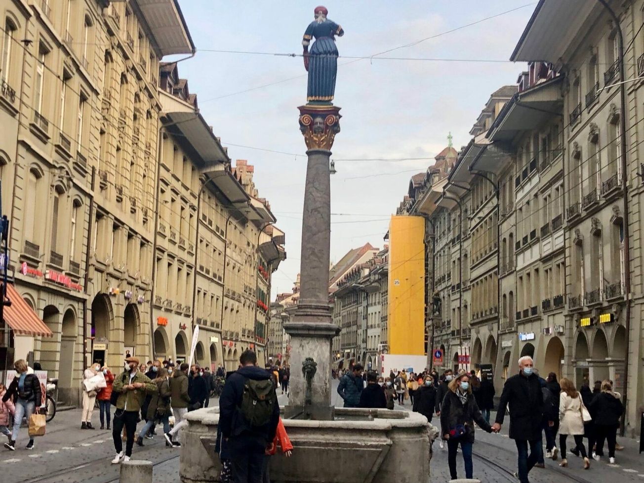Mask-wearing shoppers in the Swiss capital Bern's medieval downtown