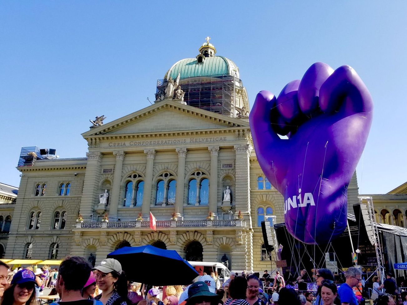A trade union float appears beside the Swiss Parliament building  Bern in June 2023