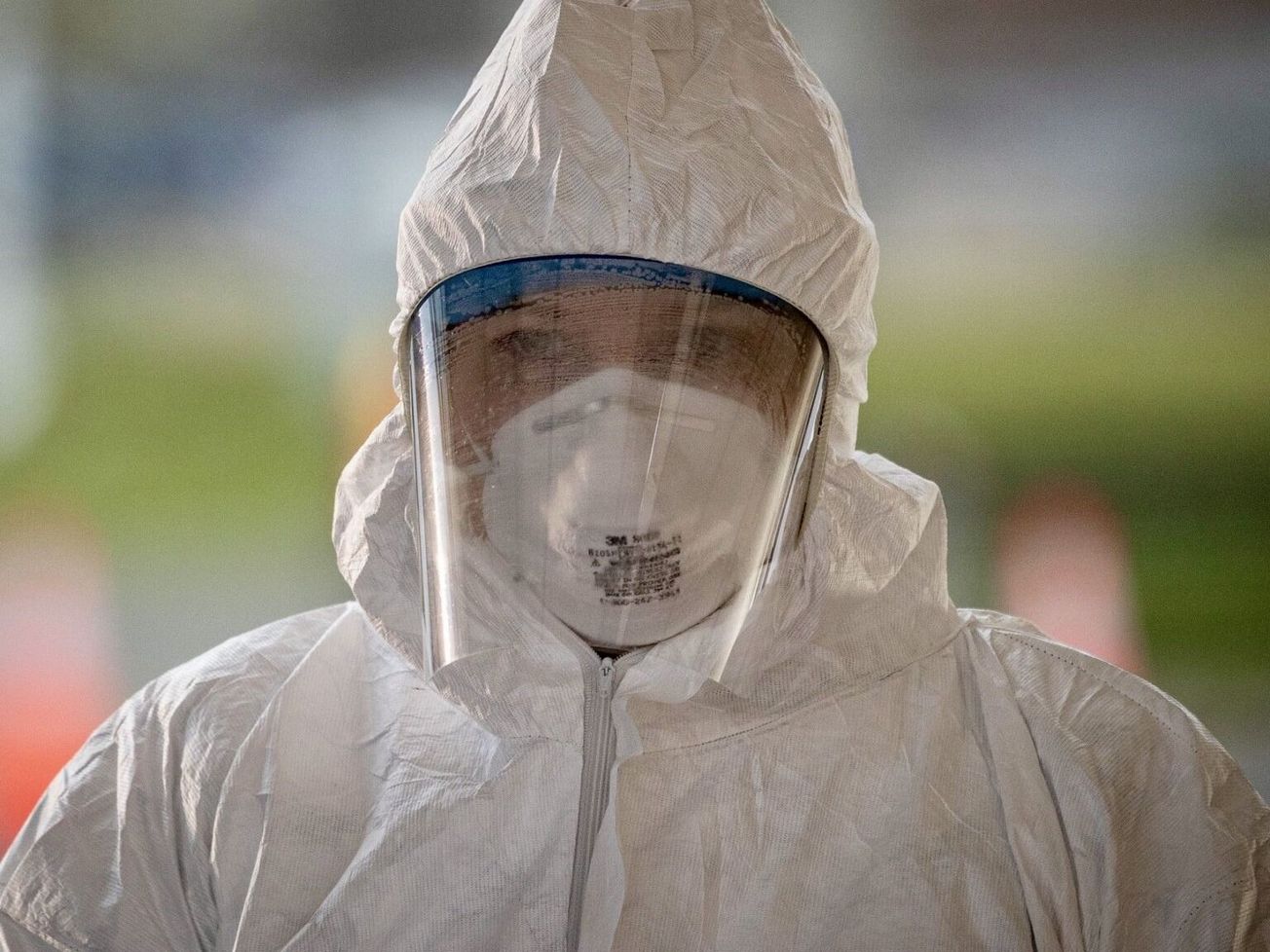 A medical technician pauses between patients at a U.S. COVID-19 testing site in New Jersey