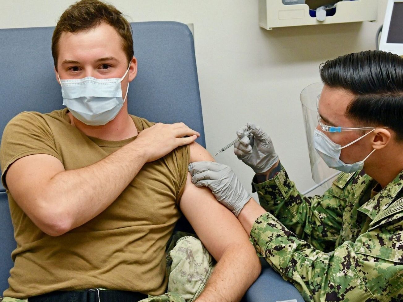 A U.S. Navy hospital apprentice in Hawaii receives the Pfizer-BioNTech COVID-19 vaccine