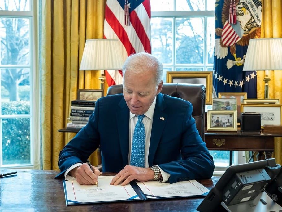 U.S. President Biden signing a fiscal measure on March 1 in the Oval Office.