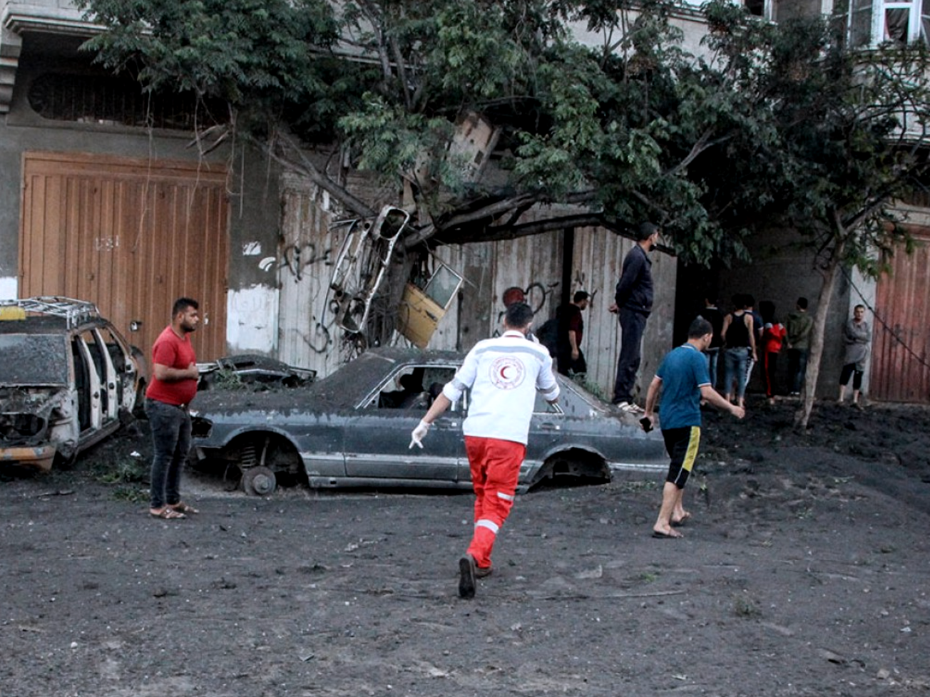 A Palestinian Red Crescent Society aid worker provides health services in Gaza.