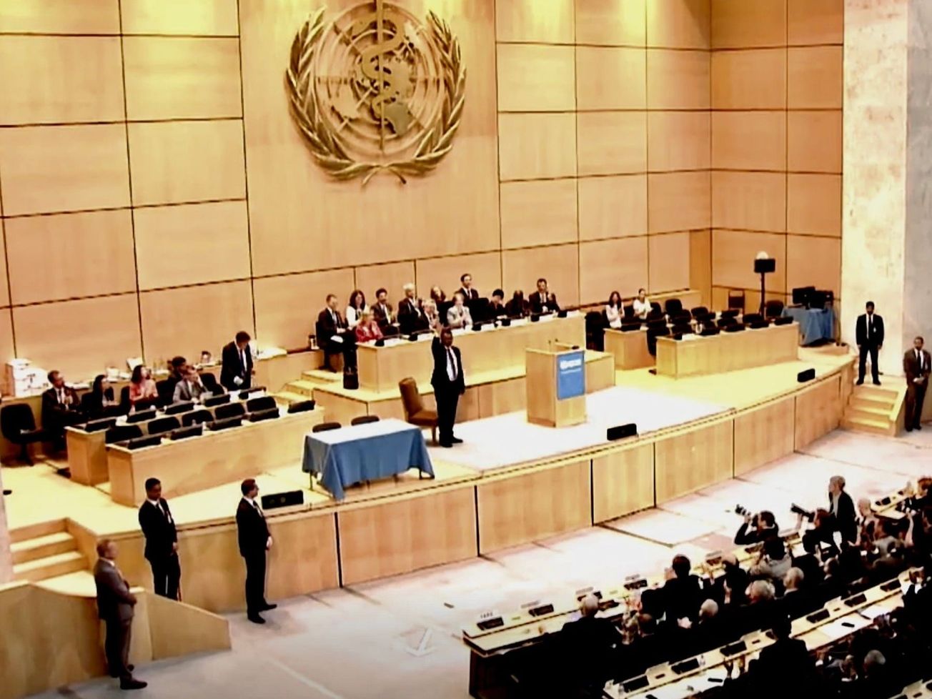 WHO Director-General Tedros Adhanom Ghebreyesus waves to delegates at the opening of the World Health Assembly.