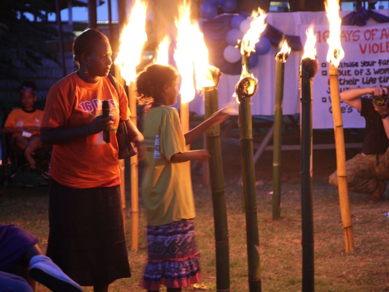 Women light 16 symbolic candles in the Solomon Islands