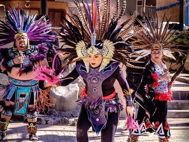 Native American dancers perform on the plaza in Taos, New Mexico.