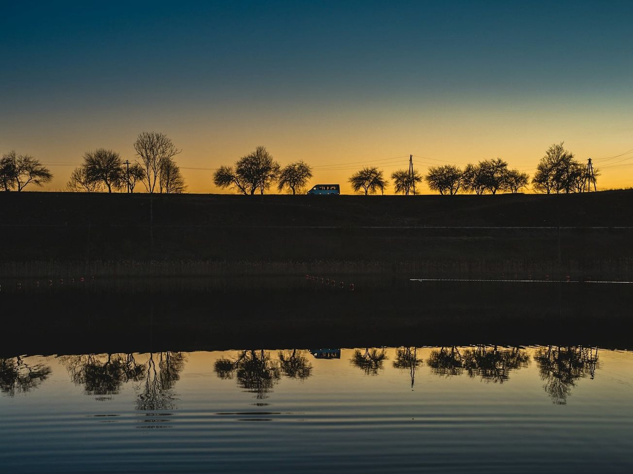 Sunset reflected in a lake at Brocēni, Latvia
