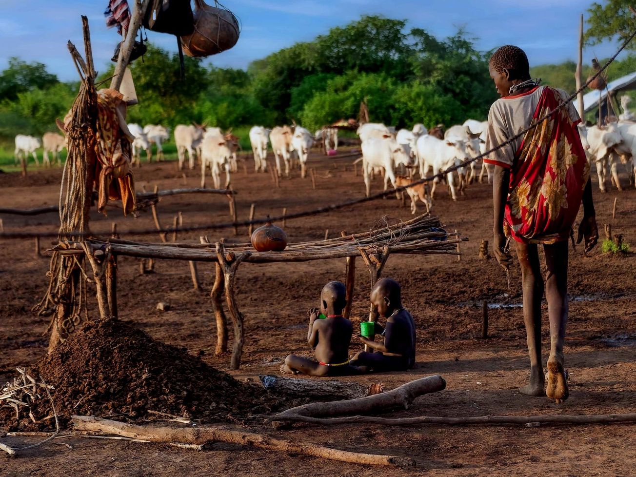 Mundari tribe children at a cattle camp breakfast in South Sudan.