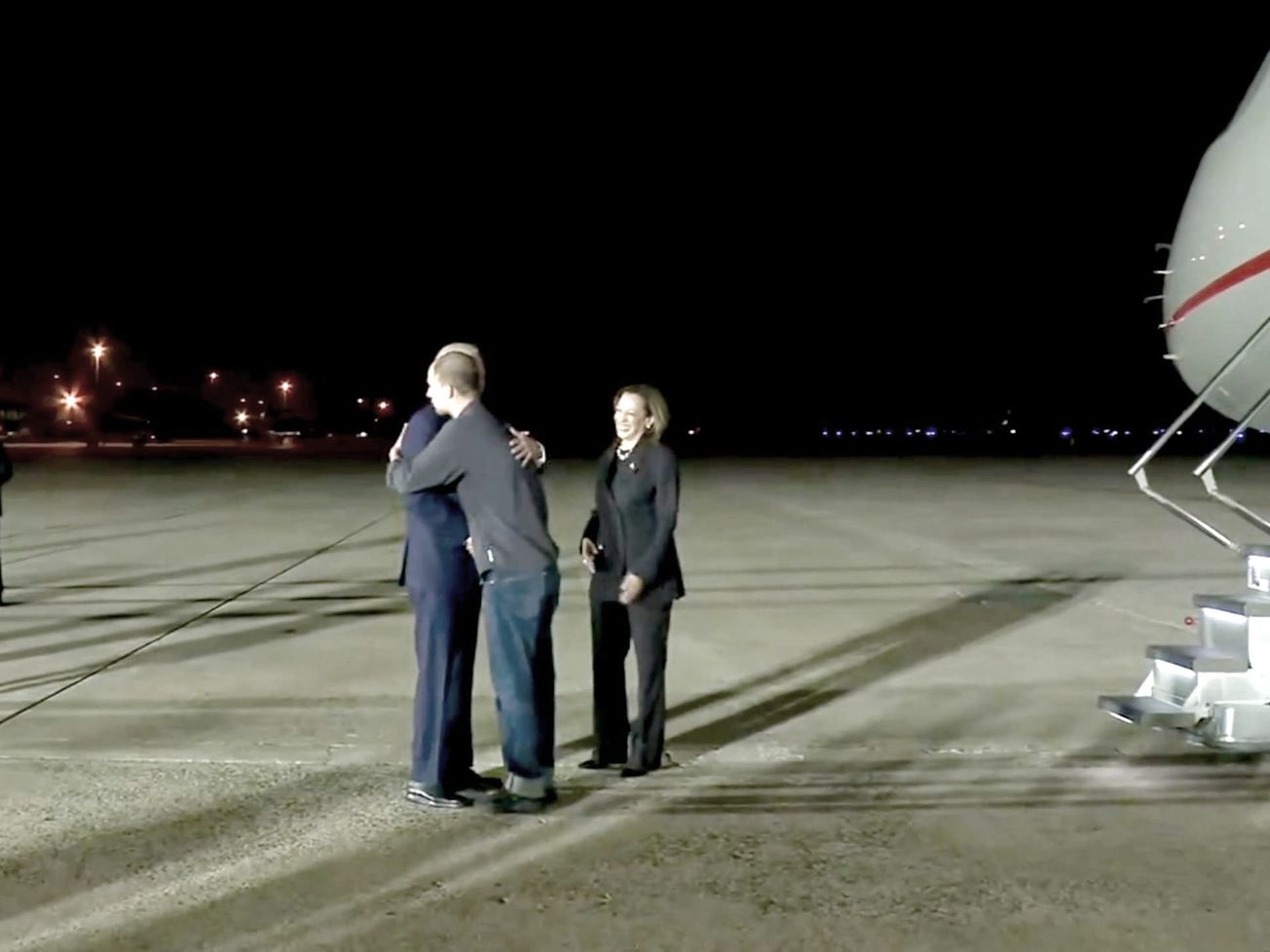 Evan Gerschkovich is greeted by U.S. President Joe Biden and Vice President Kamala Harris at Joint Base Andrews, Maryland.