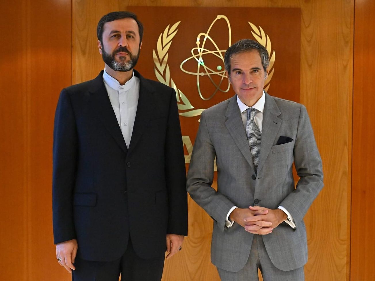 Iranian Deputy Foreign Minister Kazem Gharib Abadi, left, meets with IAEA Director-General Rafael Mariano Grossi.