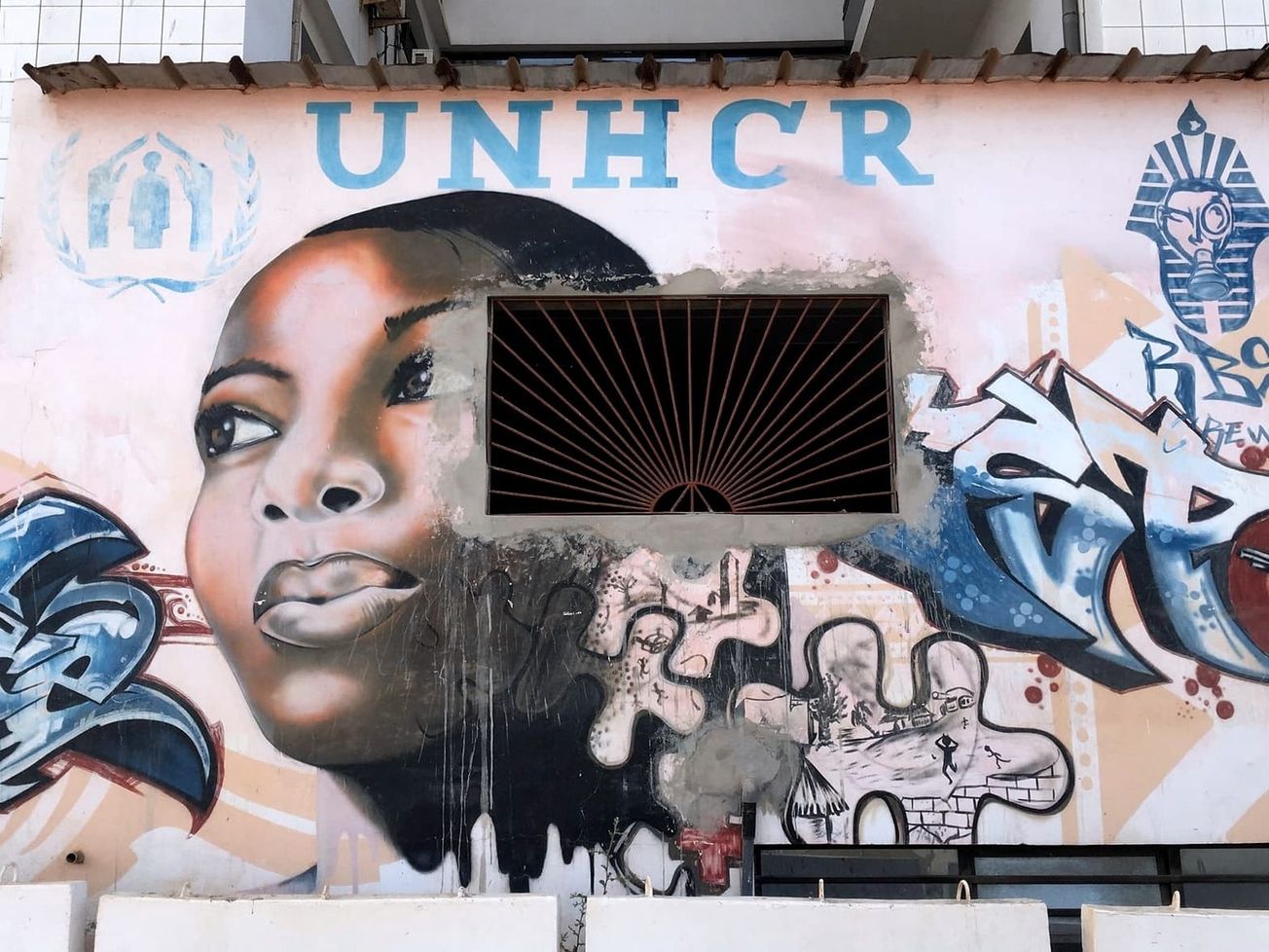 A mural about the U.N. refugee agency in Dakar, Senegal in 2019. 