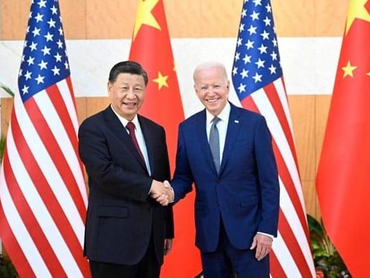 Chinese President Xi Jinping and U.S. President Joe Biden shake hands during the G-20 summit in Bali, Indonesia.