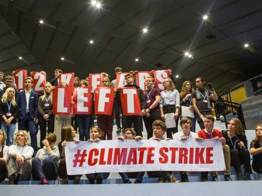 School kids demonstrate on the last day of U.N. climate talks in Poland.