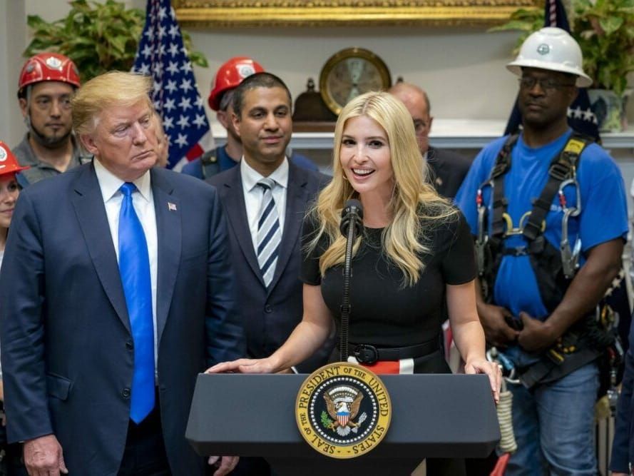 U.S. President Donald Trump listens as his daughter, Presidential Advisor Ivanka Trump, delivers remarks.