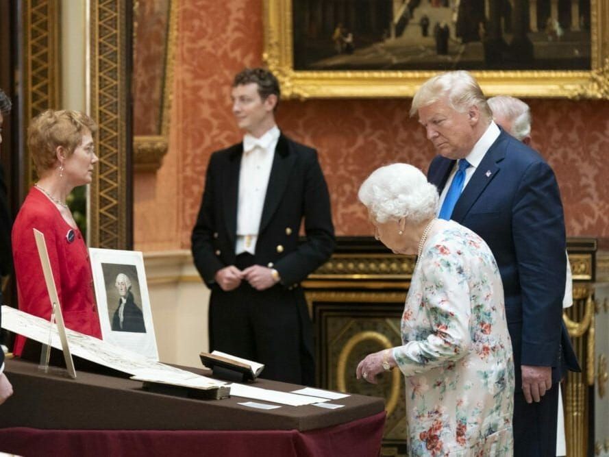 Queen Elizabeth II and U.S. President Donald Trump view American items in the Royal Collection at Buckingham Palace.