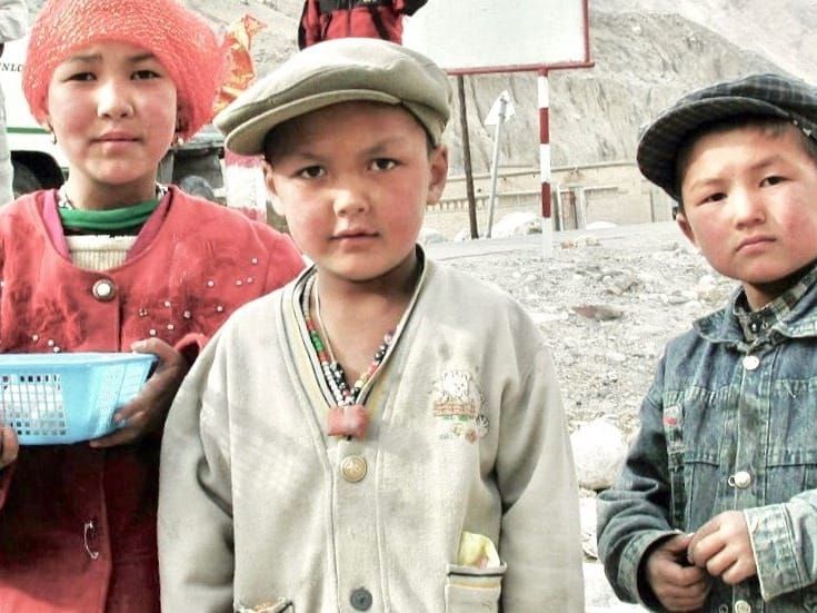 Tajik children selling eggs to travelers along the Karakoram Highway