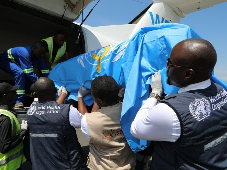 The body of a WHO doctor responding to the Ebola outbreak is loaded on a plane in Goma, Congo.