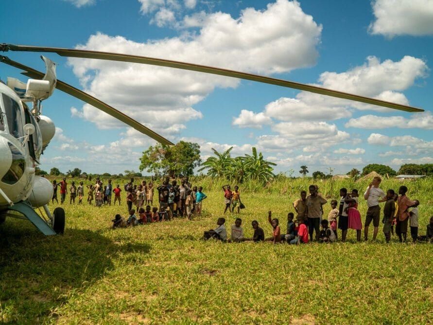 A World Food Program helicopter brings aid to Bebedo, Mozambique.