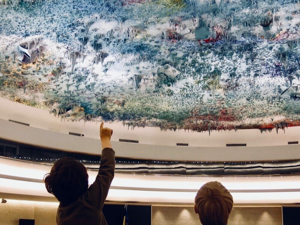 Visitors gaze at Spanish abstract artist Miquel Barceló's ceiling painting in the U.N. Human Rights Council.