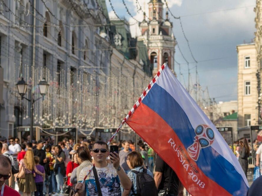 A man waves a Russian FIFA flag in Moscow.
