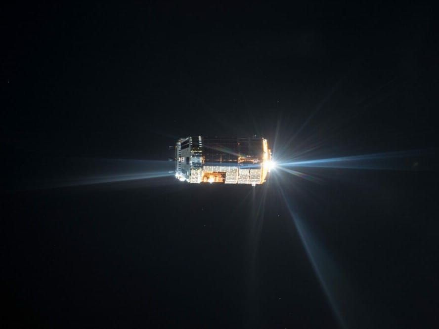 A Japanese transfer vehicle approaches International Space Station.