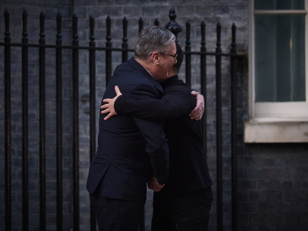 U.K. Prime Minister Keir Starmer embraces Ukrainian President Volodymyr Zelenskyy in London.