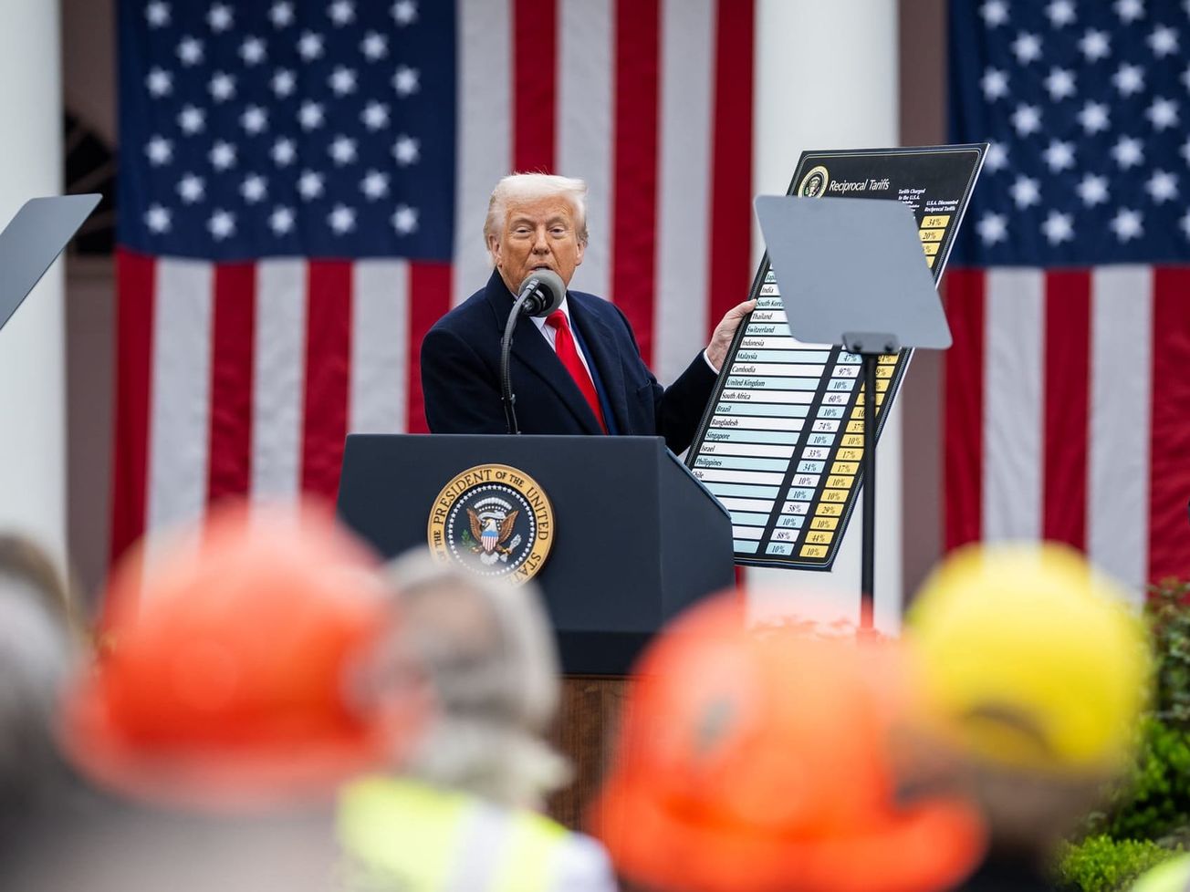 At the White House, U.S. President Donald Trump holds a chart to explain why he imposed a 10% tariff on imports from all countries.