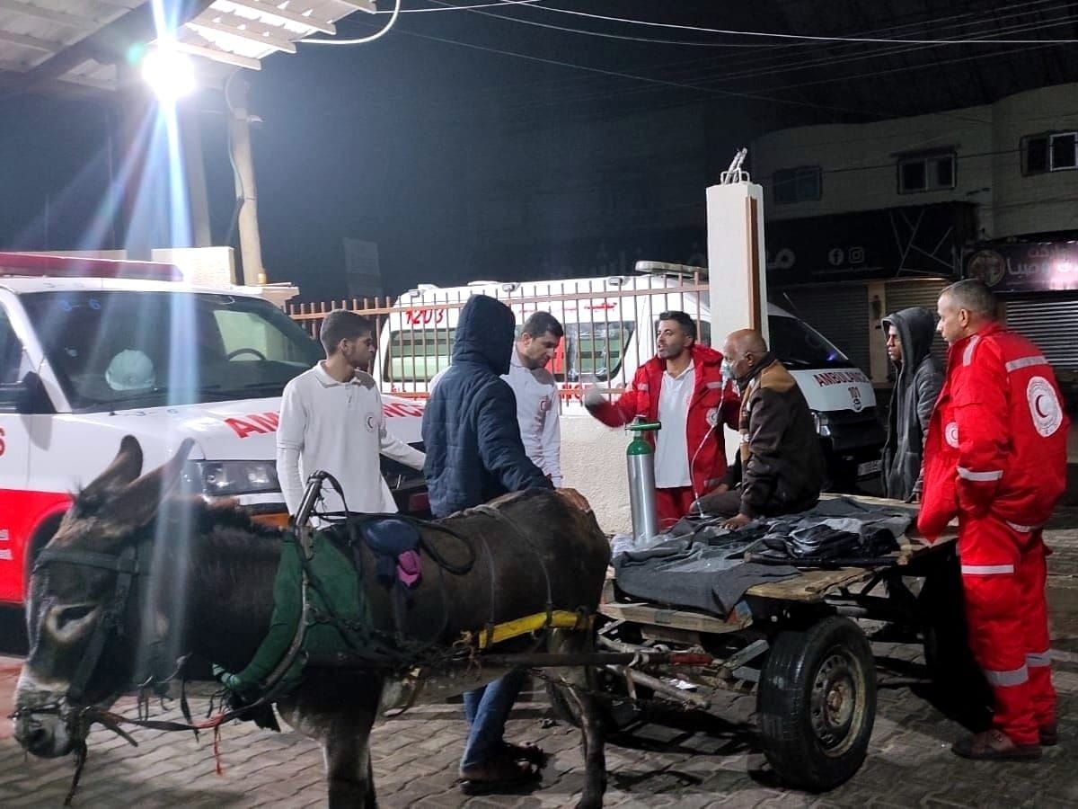 An injured Palestinian arrives by donkey at an emergency medical clinic in Gaza.